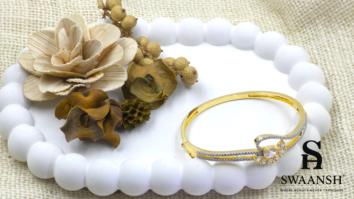 Gold floral bracelet with oval and pear-cut crystals set on dual crystal-lined bands – Swaansh