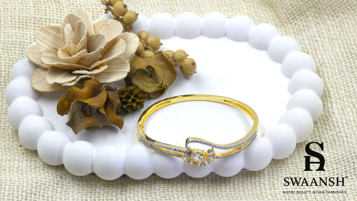 Gold floral bracelet with oval and pear-cut crystals set on dual crystal-lined bands – Swaansh
