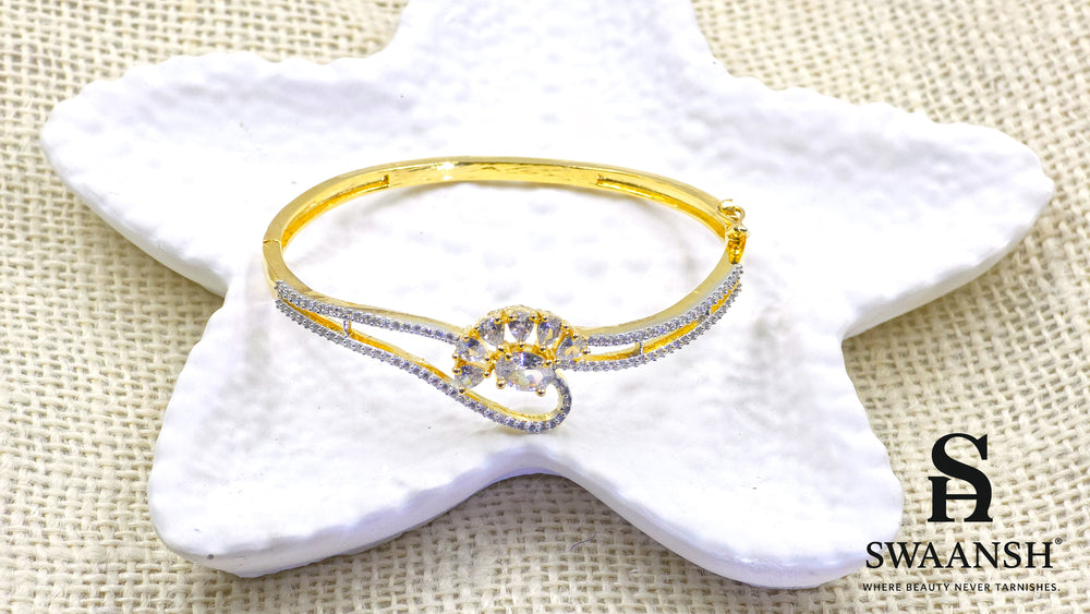 Gold floral bracelet with oval and pear-cut crystals set on dual crystal-lined bands – Swaansh