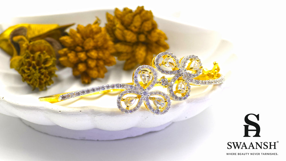 Gold bracelet with four petal-shaped crystal motifs and dual micro-studded bands – Swaansh