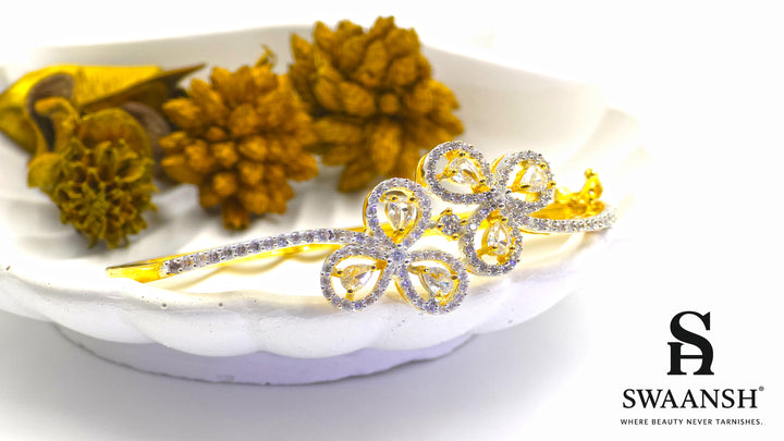 Gold bracelet with four petal-shaped crystal motifs and dual micro-studded bands – Swaansh
