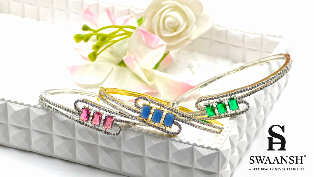 Silver bracelet with three pink baguette stones and dual pavé crystal swirl lines – Swaansh
