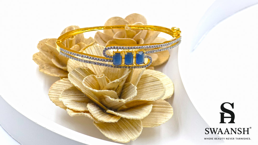 Gold bracelet with three blue rectangular stones and twin pavé crystal swirl lines – Swaansh