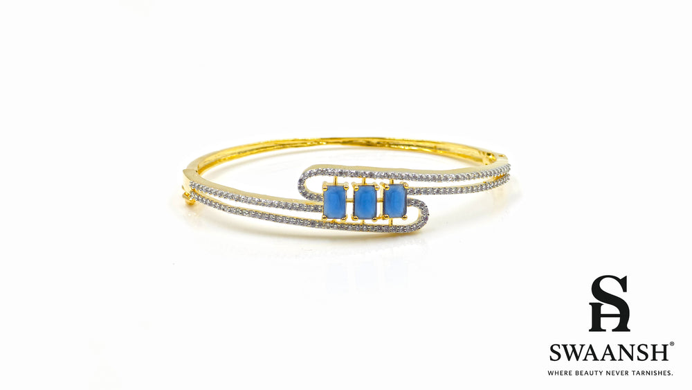 Gold bracelet with three blue rectangular stones and twin pavé crystal swirl lines – Swaansh