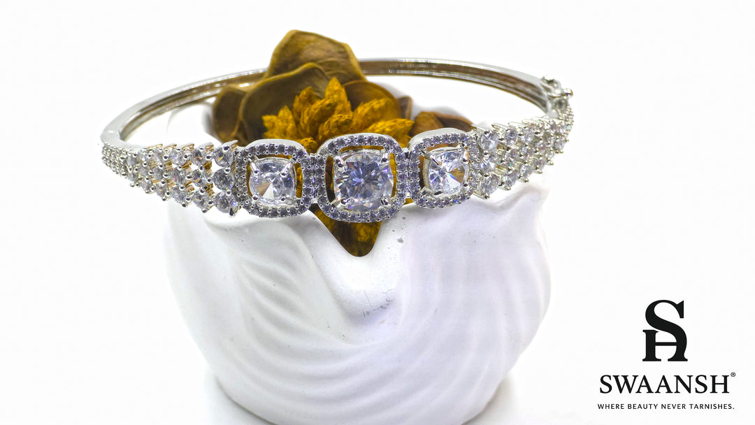 Anti-tarnish silver bracelet with three cushion-cut CZ stones in halo setting, tapering design – Swaansh