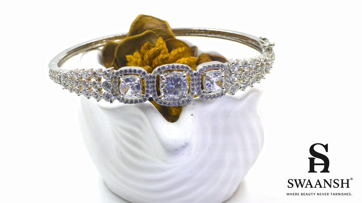 Anti-tarnish silver bracelet with three cushion-cut CZ stones in halo setting, tapering design – Swaansh