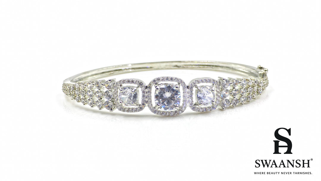Anti-tarnish silver bracelet with three cushion-cut CZ stones in halo setting, tapering design – Swaansh