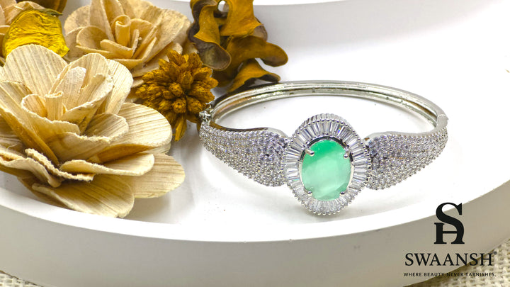 Silver-toned bracelet with oval green stone, surrounded by baguette-cut CZs – BPR111 anti-tarnish festive jewellery by Swaansh