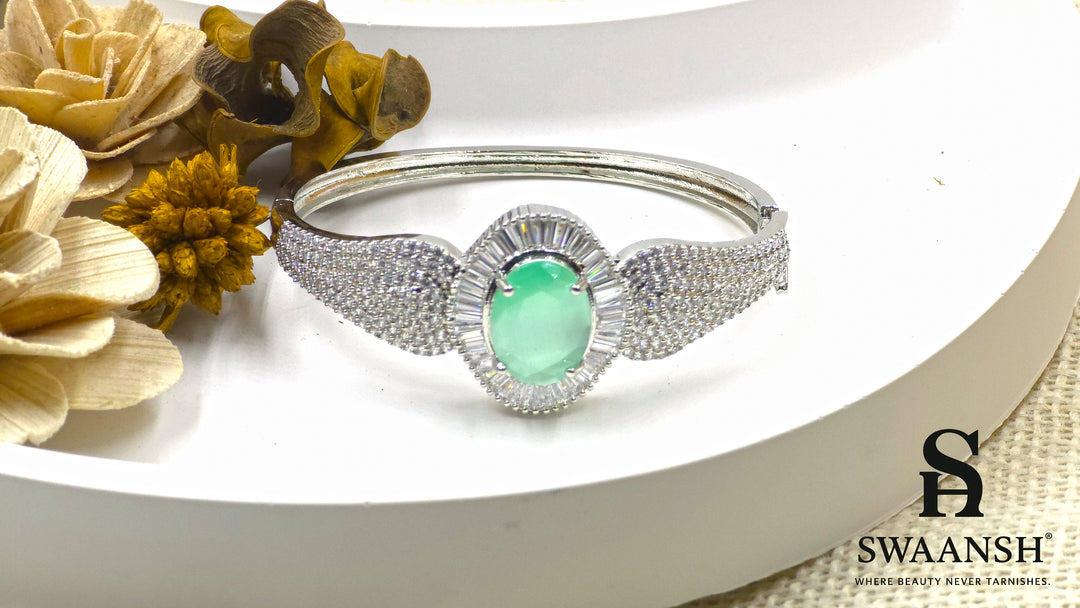 Silver-toned bracelet with oval green stone, surrounded by baguette-cut CZs – BPR111 anti-tarnish festive jewellery by Swaansh