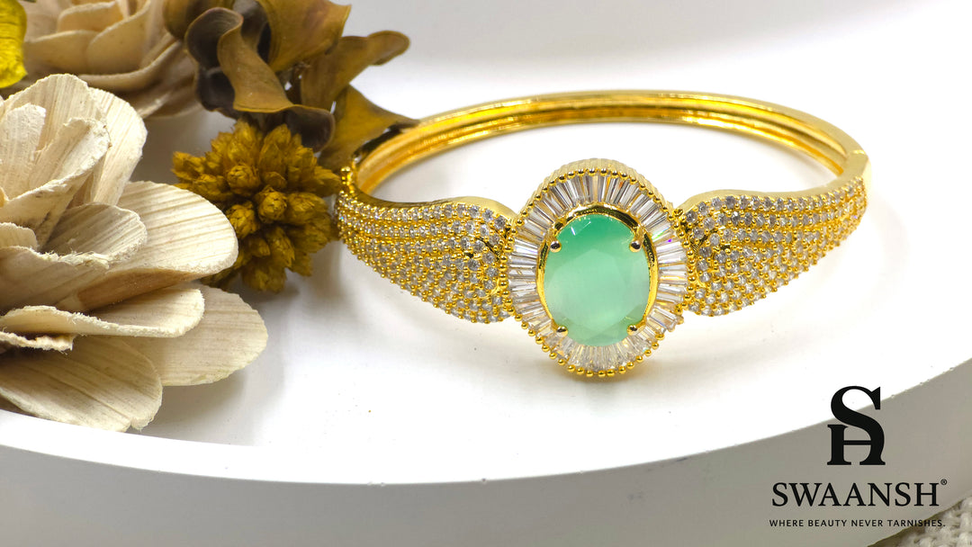 Gold-plated bracelet with a large oval green stone and CZ-studded body – Indian festive bracelet from Swaansh