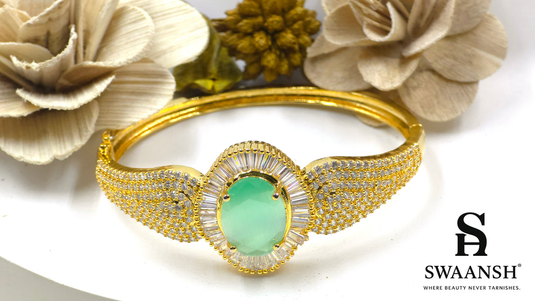 Gold-plated bracelet with a large oval green stone and CZ-studded body – Indian festive bracelet from Swaansh