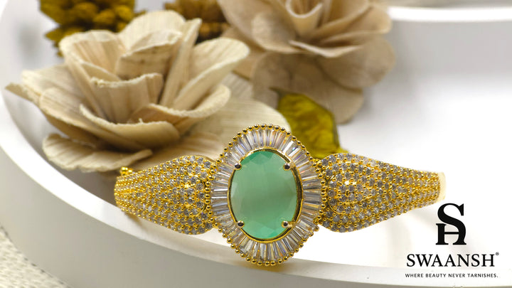 Gold-plated bracelet with a large oval green stone and CZ-studded body – Indian festive bracelet from Swaansh