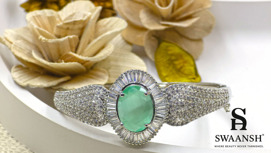 Silver-toned bracelet with oval green stone, surrounded by baguette-cut CZs – BPR111 anti-tarnish festive jewellery by Swaansh