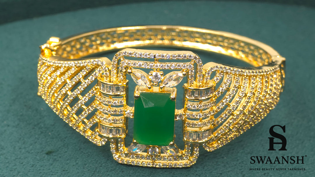 Gold bracelet with rectangular emerald green centre and structured CZ grid design – BPR114 luxury piece by Swaansh