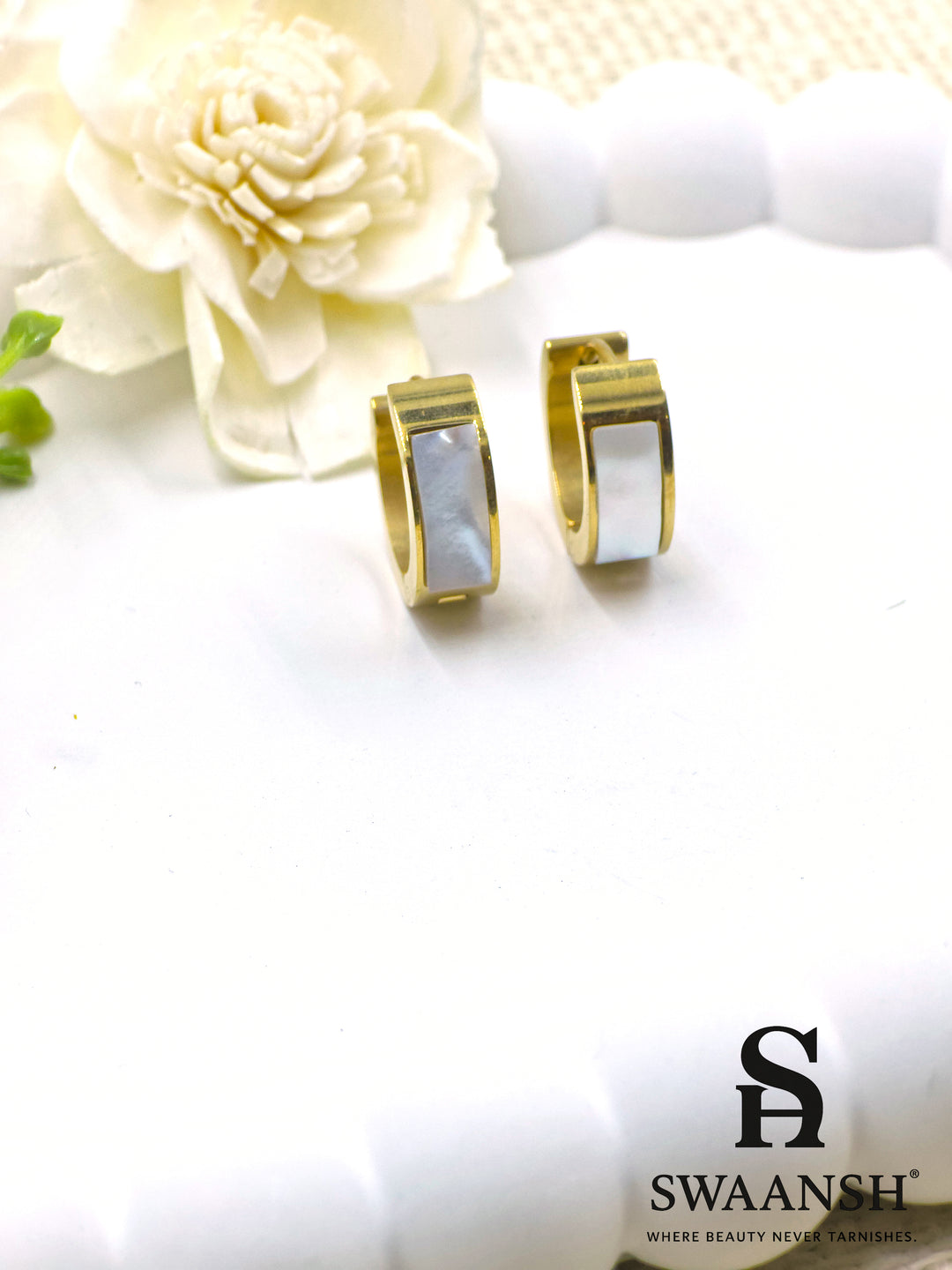 Small gold hoop earrings with white pearl-effect inlay on a white background – Swaansh jewellery