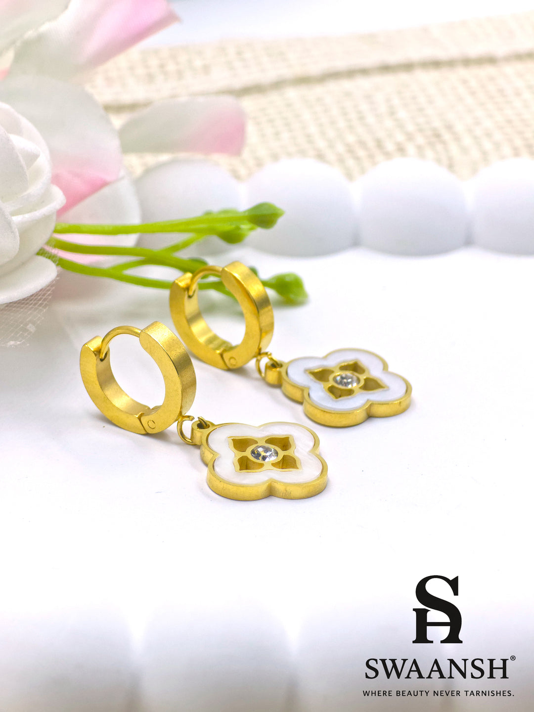 Gold hoop earrings with white enamel flower charm and crystal center – Swaansh