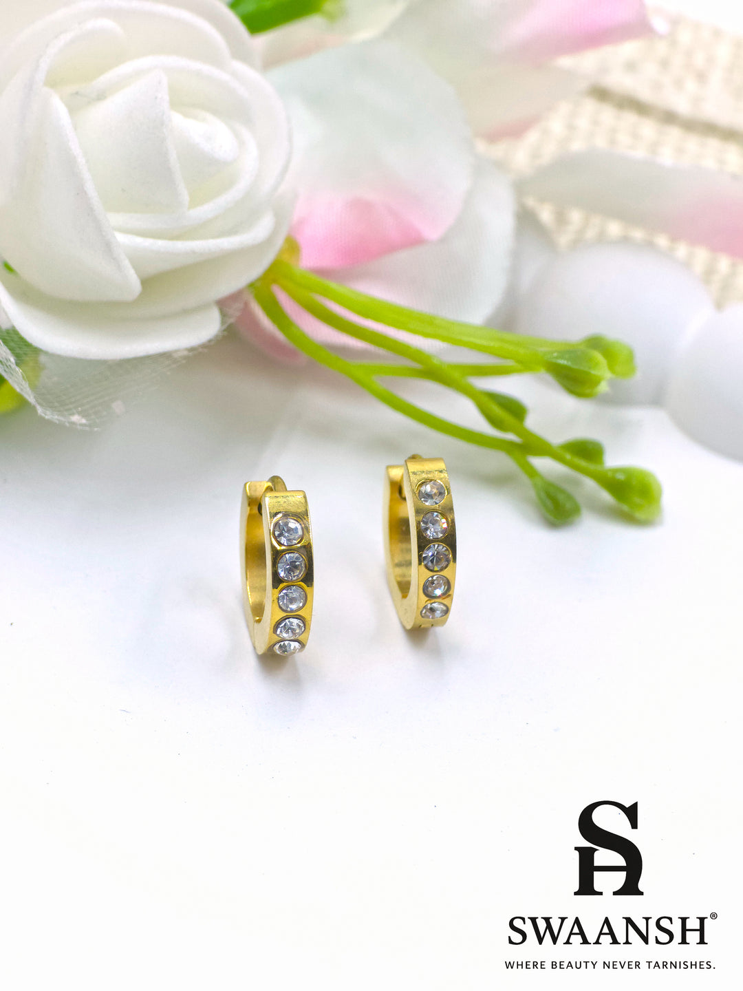 Gold hoop earrings with three embedded white crystals – Swaansh
