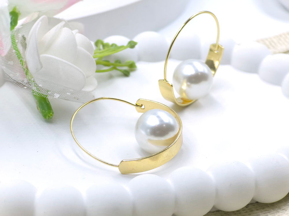 Swaansh  – gold hoops with centered white pearl, orbit-inspired statement earrings