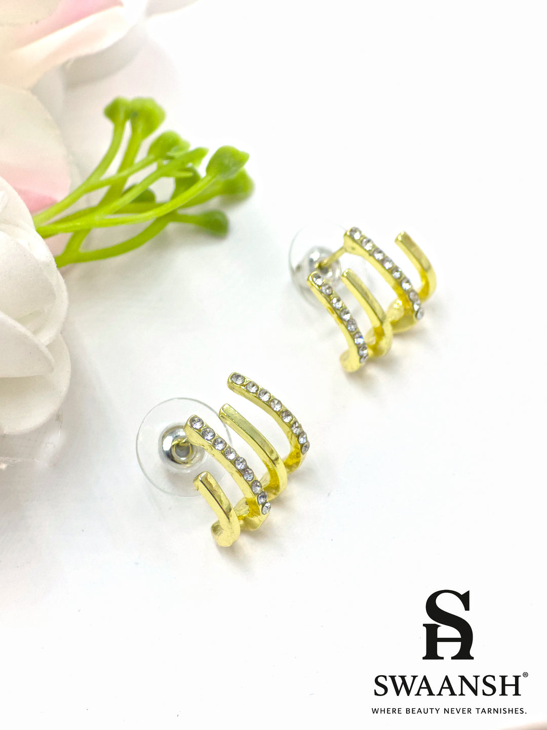 Triple arc illusion stud earrings with gold finish and white crystals – Swaansh statement piece