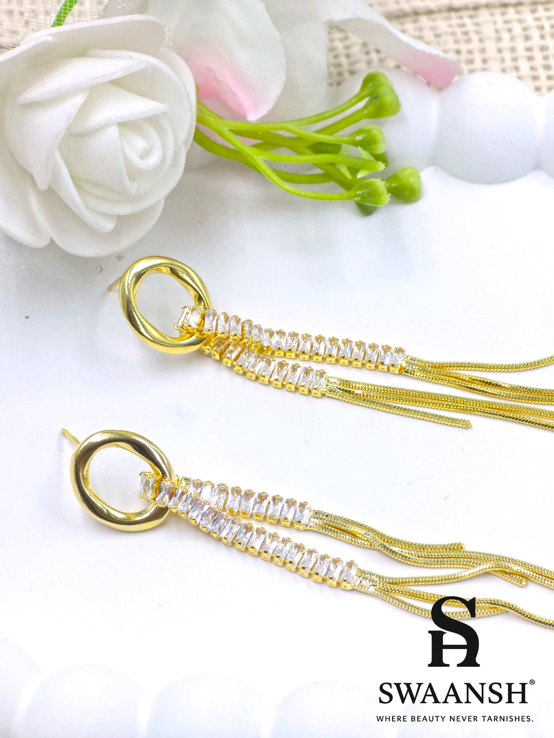 Luxury gold long earrings with baguette stones and chain tassels – Swaansh