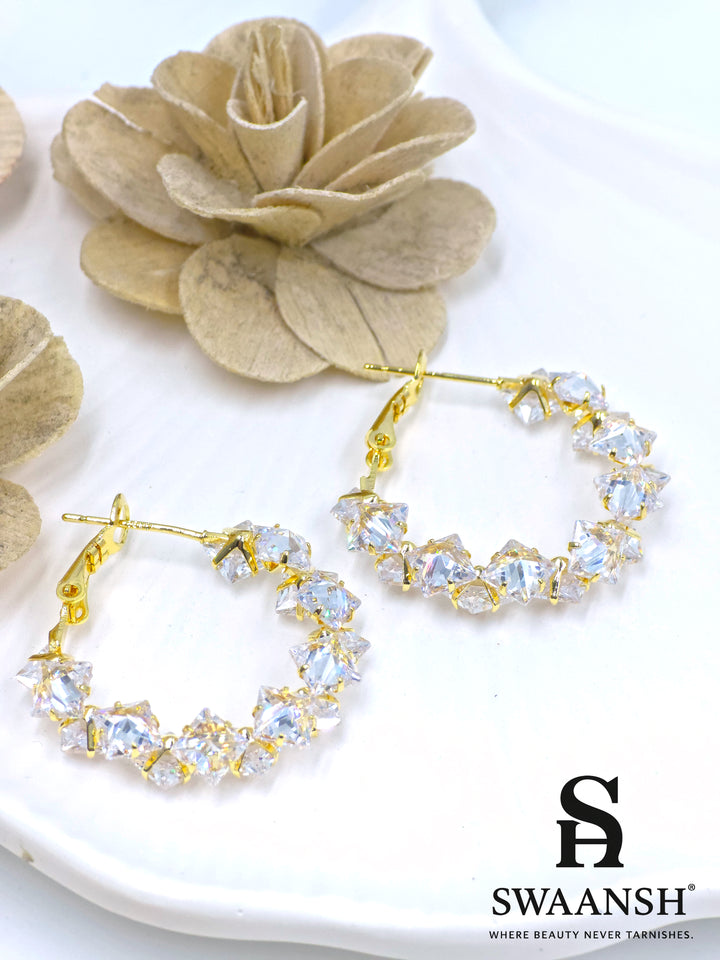 Crystal gold hoop earrings with prism-cut stones on white background – Swaansh 