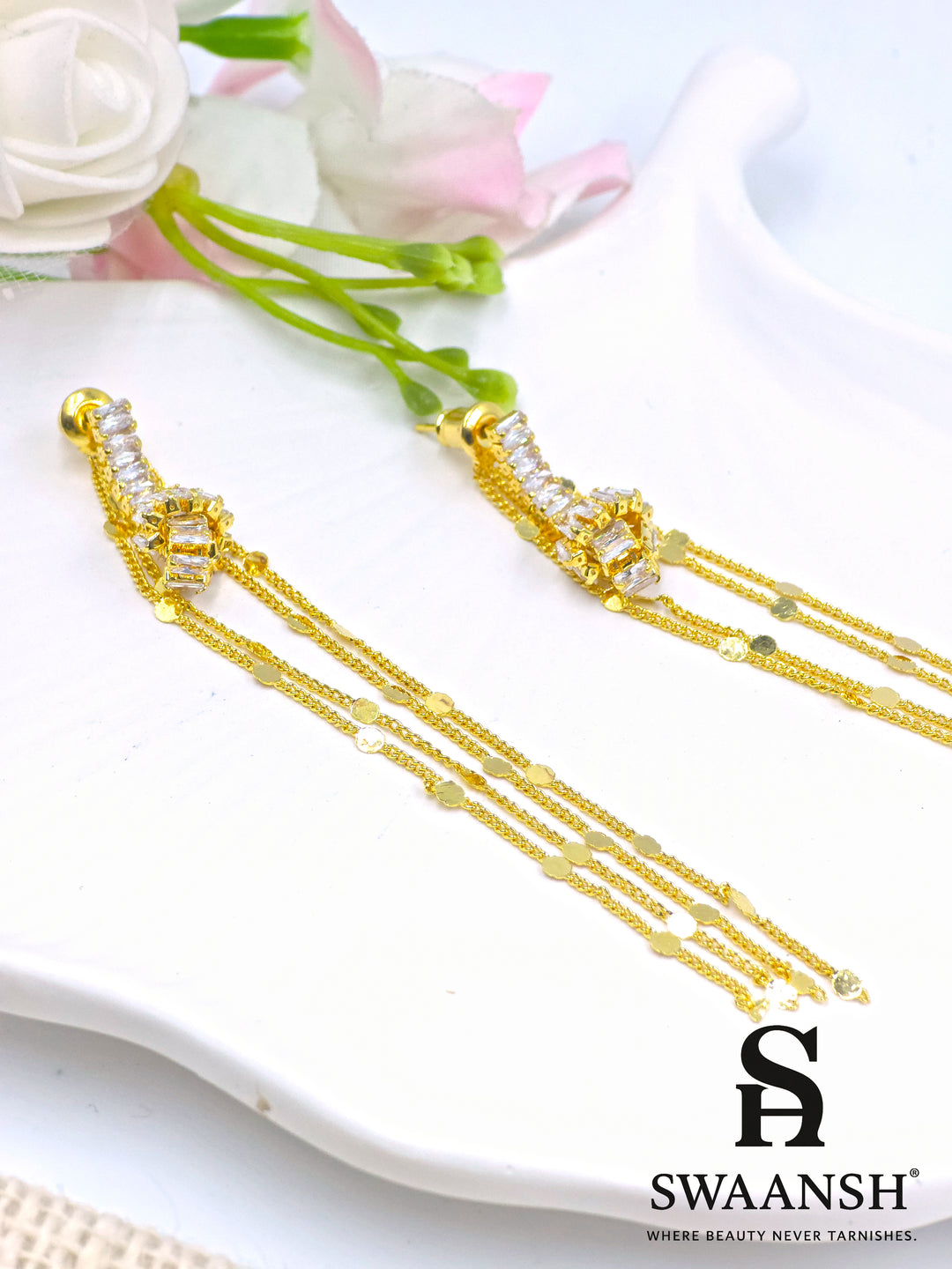 Long gold tassel earrings with baguette-cut crystals and disc chains – Swaansh