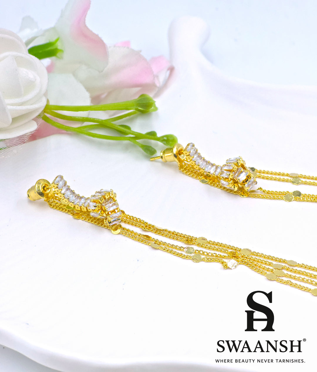 Long gold tassel earrings with baguette-cut crystals and disc chains – Swaansh