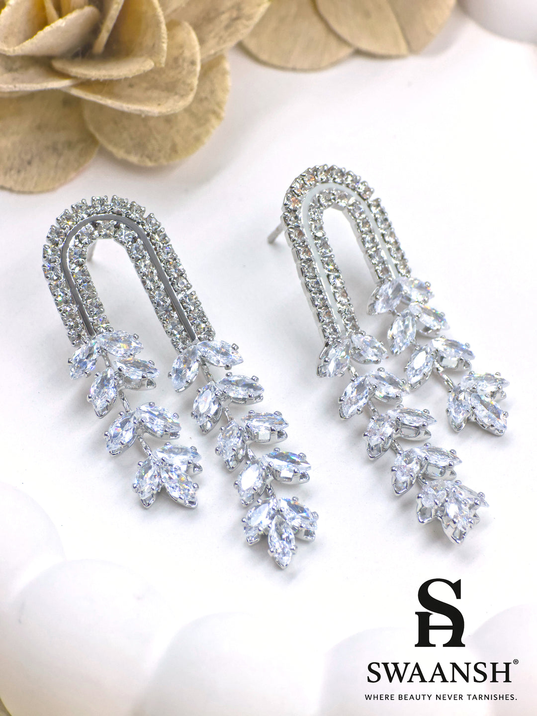 Silver U-shaped earrings with cascading marquise crystals and dual crystal arcs – Swaansh