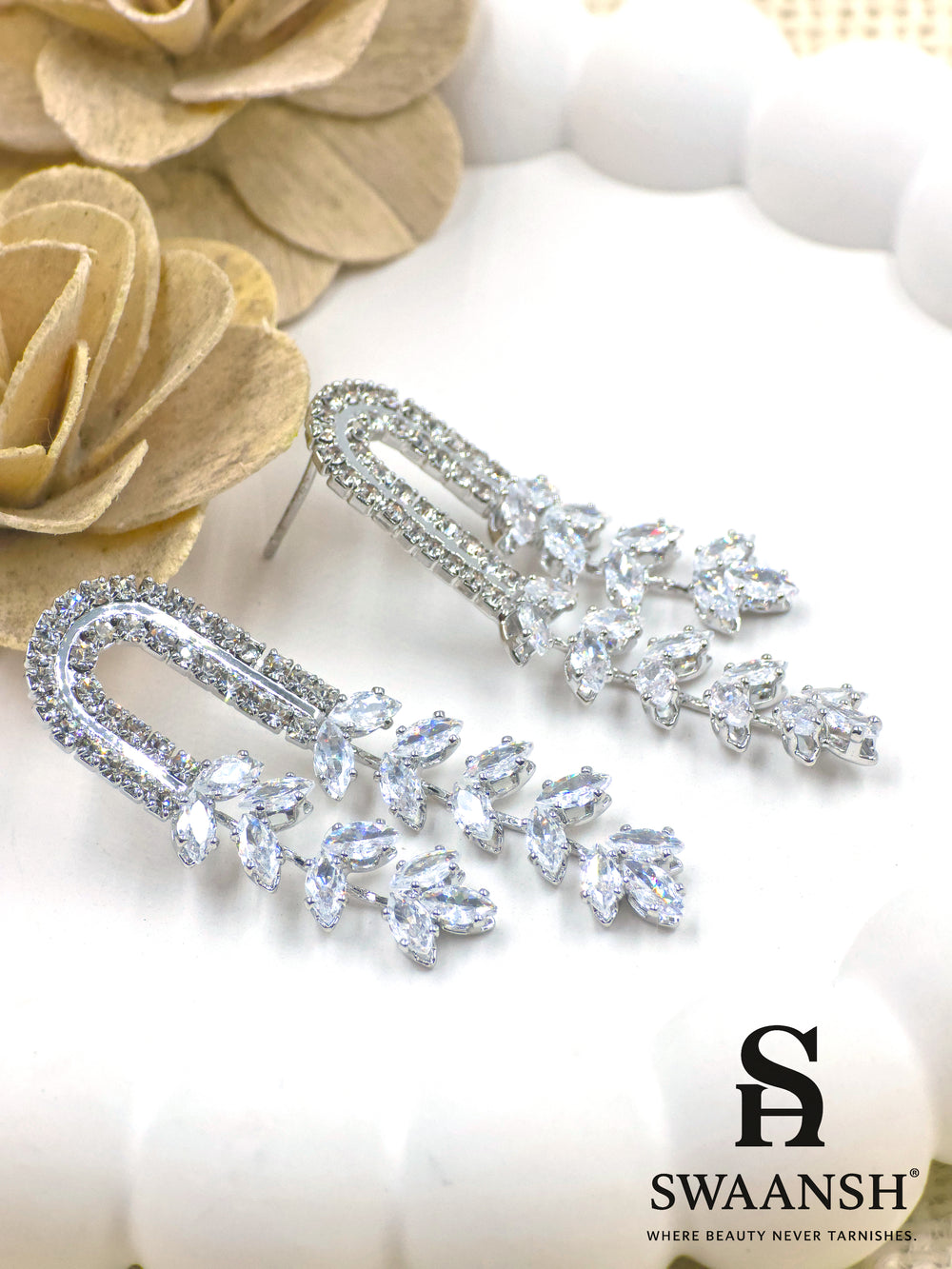 Silver U-shaped earrings with cascading marquise crystals and dual crystal arcs – Swaansh