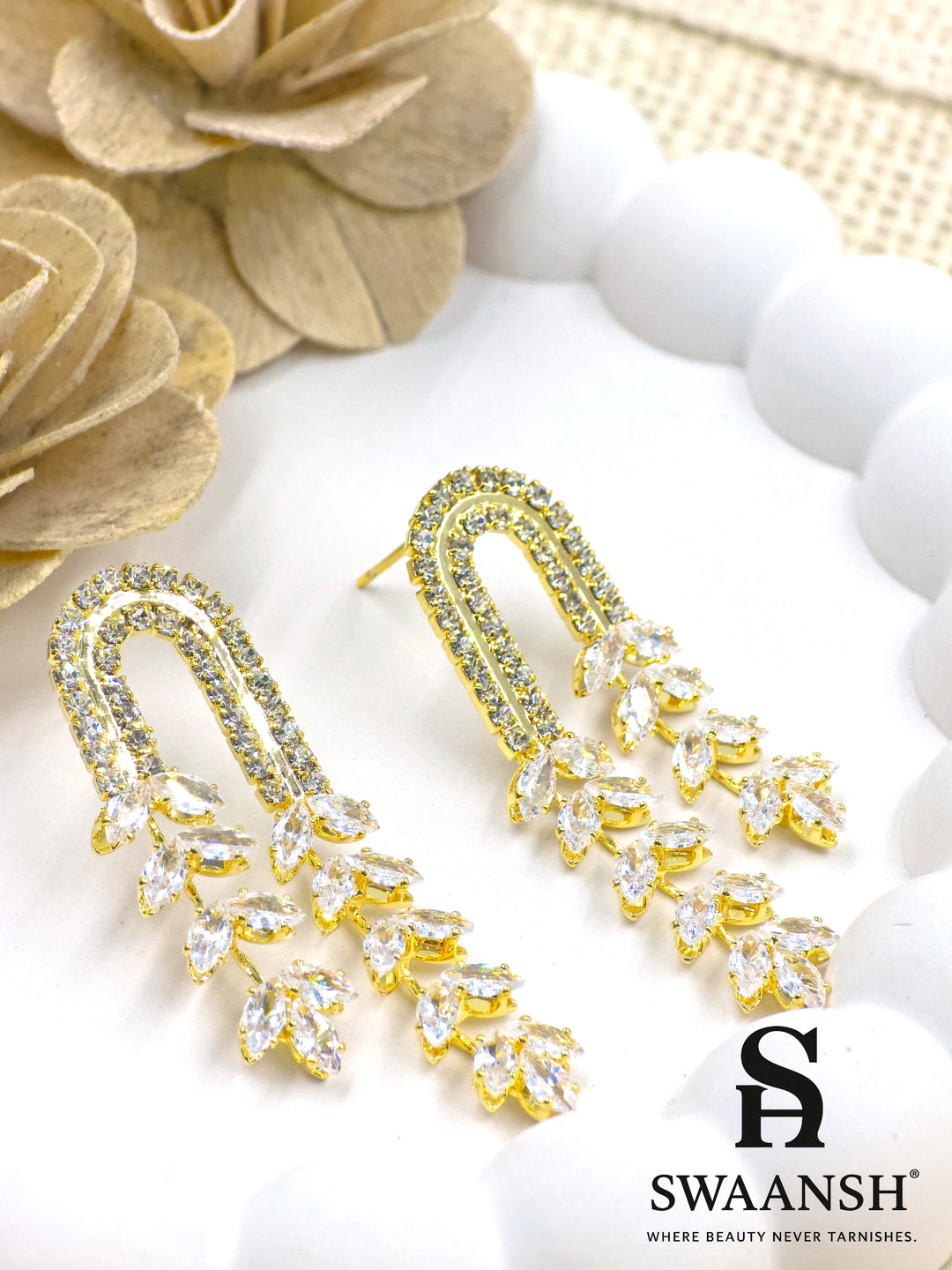 Gold U-shaped earrings with cascading marquise-cut crystal vines and twin crystal arcs – Swaansh