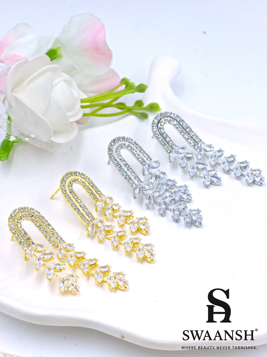 Gold U-shaped earrings with cascading marquise-cut crystal vines and twin crystal arcs – Swaansh