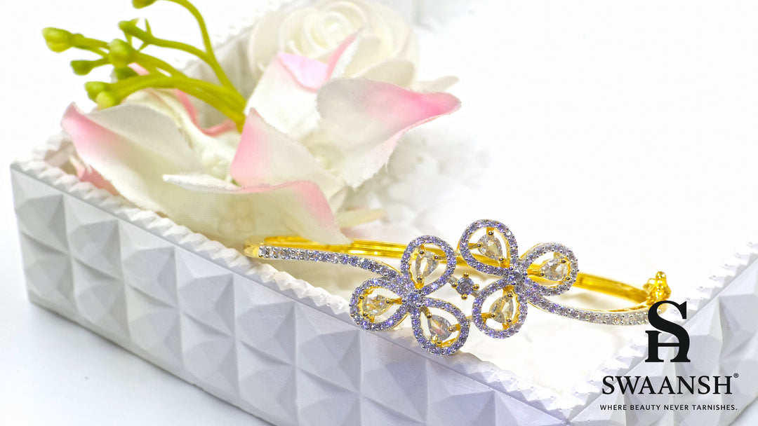 Gold bracelet with four petal-shaped crystal motifs and dual micro-studded bands – Swaansh