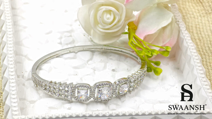 Anti-tarnish silver bracelet with three cushion-cut CZ stones in halo setting, tapering design – Swaansh