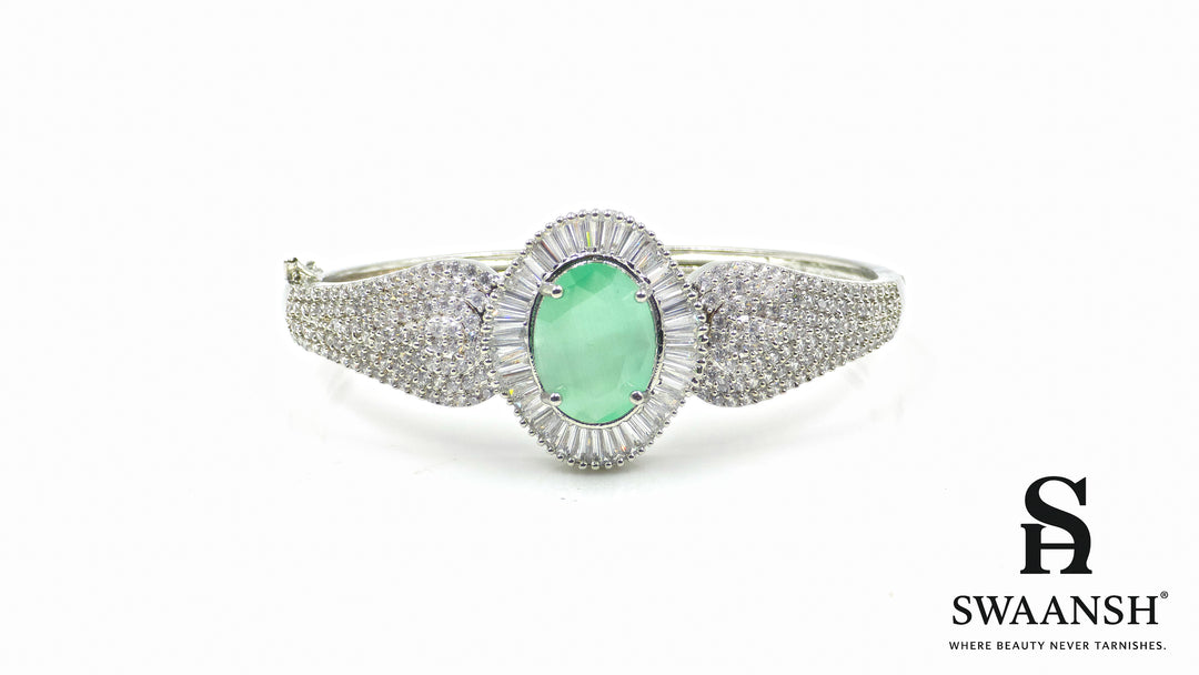 Silver-toned bracelet with oval green stone, surrounded by baguette-cut CZs – BPR111 anti-tarnish festive jewellery by Swaansh