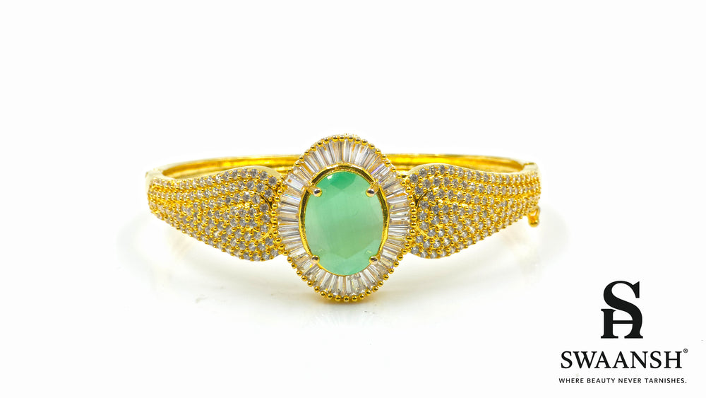 Gold-plated bracelet with a large oval green stone and CZ-studded body – Indian festive bracelet from Swaansh