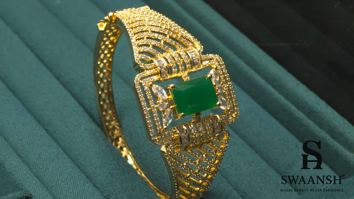 Gold bracelet with rectangular emerald green centre and structured CZ grid design – BPR114 luxury piece by Swaansh