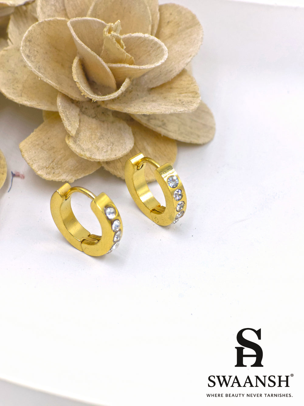Gold hoop earrings with three embedded white crystals – Swaansh