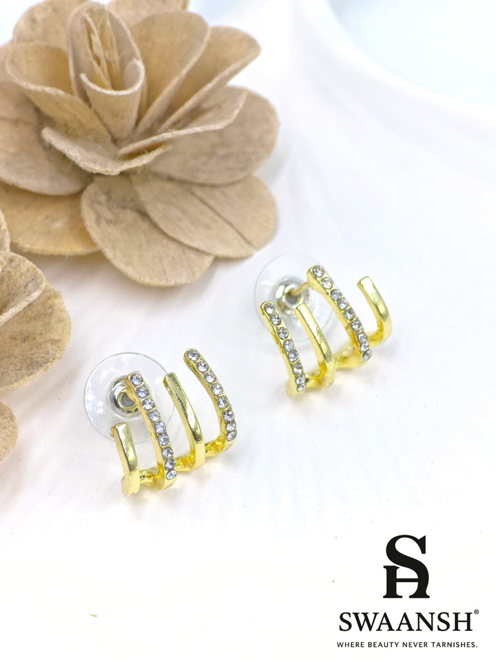 Triple arc illusion stud earrings with gold finish and white crystals – Swaansh statement piece