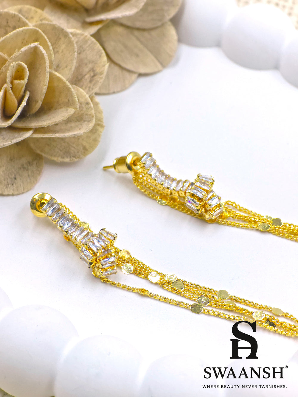 Long gold tassel earrings with baguette-cut crystals and disc chains – Swaansh