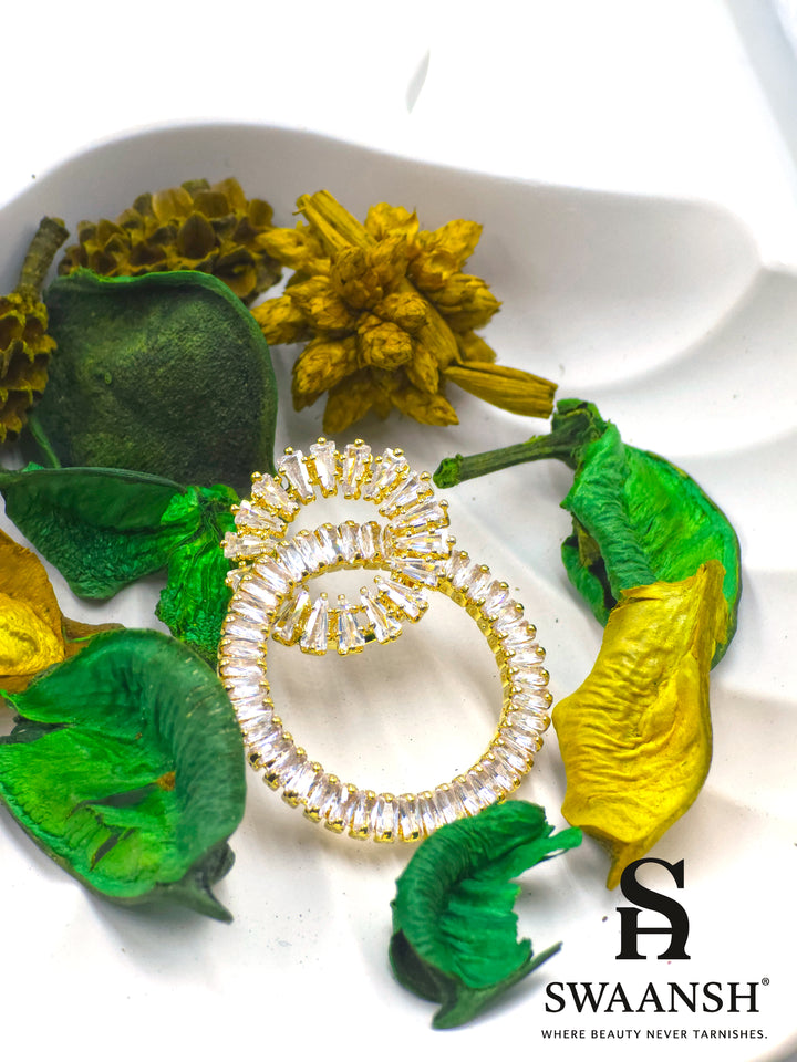 Gold double-loop earrings with baguette crystals in a luxe sculptural design – Swaansh