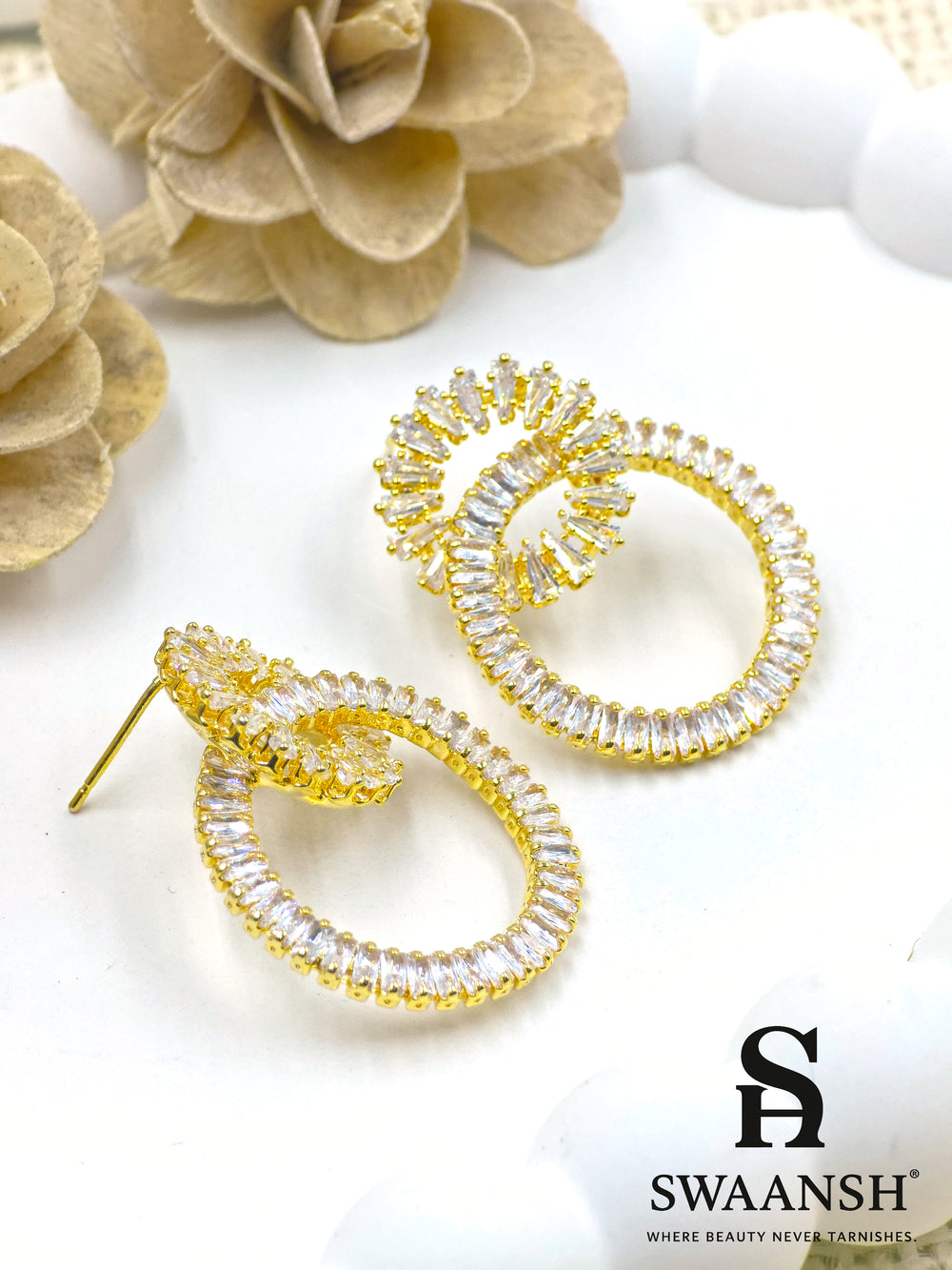 Gold double-loop earrings with baguette crystals in a luxe sculptural design – Swaansh