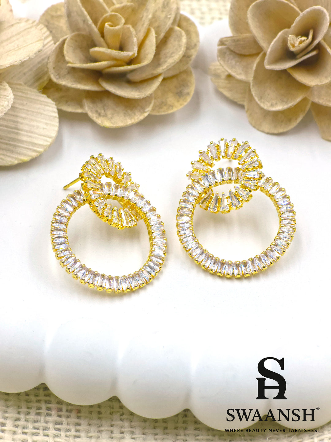 Gold double-loop earrings with baguette crystals in a luxe sculptural design – Swaansh