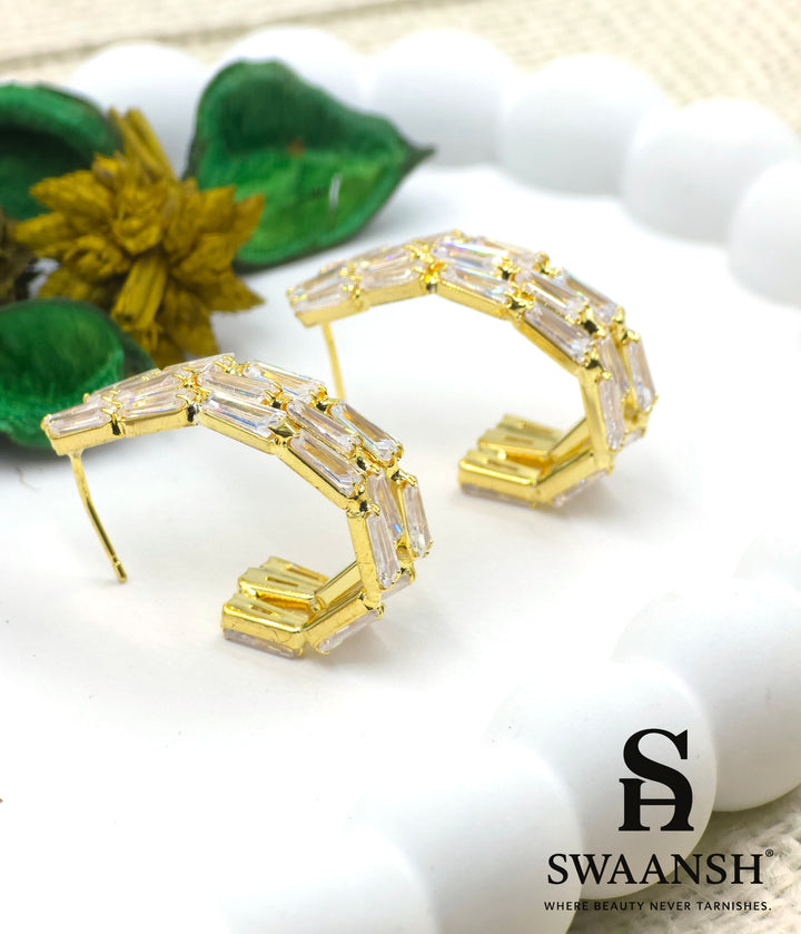 Gold angular hoop earrings with baguette-cut zirconia set in a step-like design – Swaansh