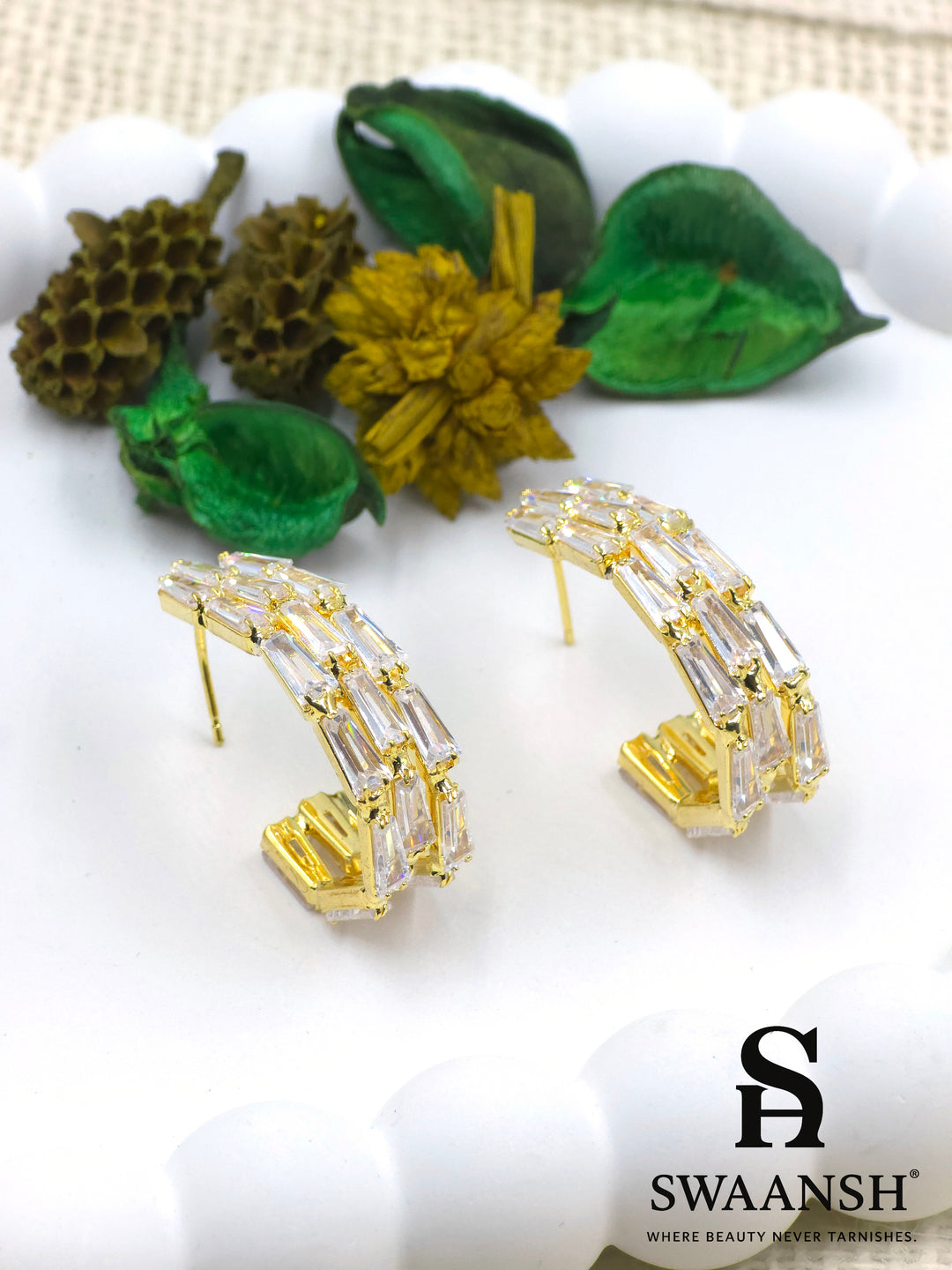 Gold angular hoop earrings with baguette-cut zirconia set in a step-like design – Swaansh