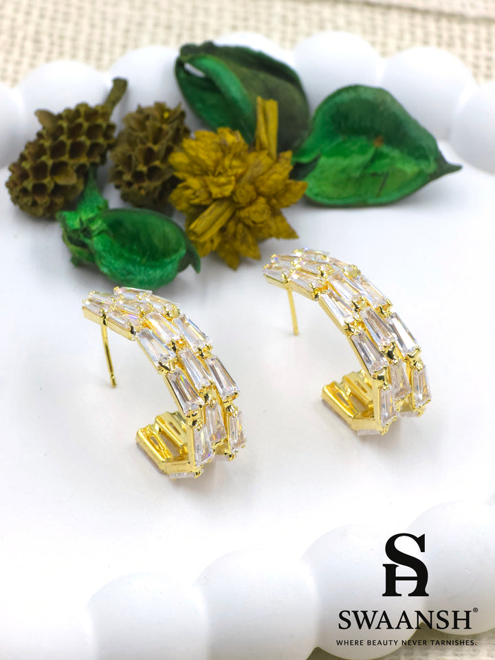 Gold angular hoop earrings with baguette-cut zirconia set in a step-like design – Swaansh