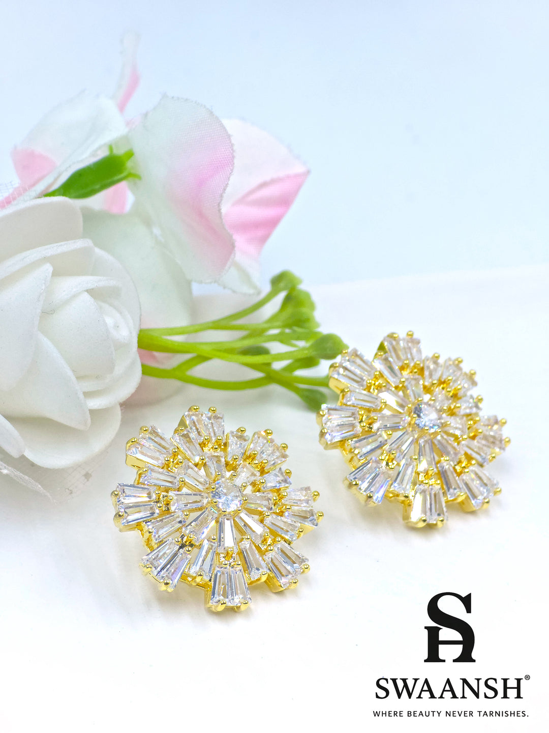 Gold burst earrings with baguette-cut zirconia and central round stone – Swaansh