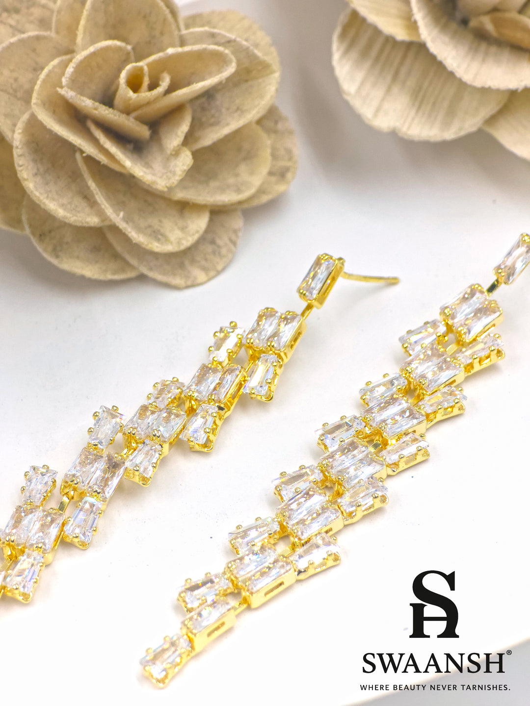 Gold long drop earrings with angular baguette-cut zirconia cascade – Swaansh