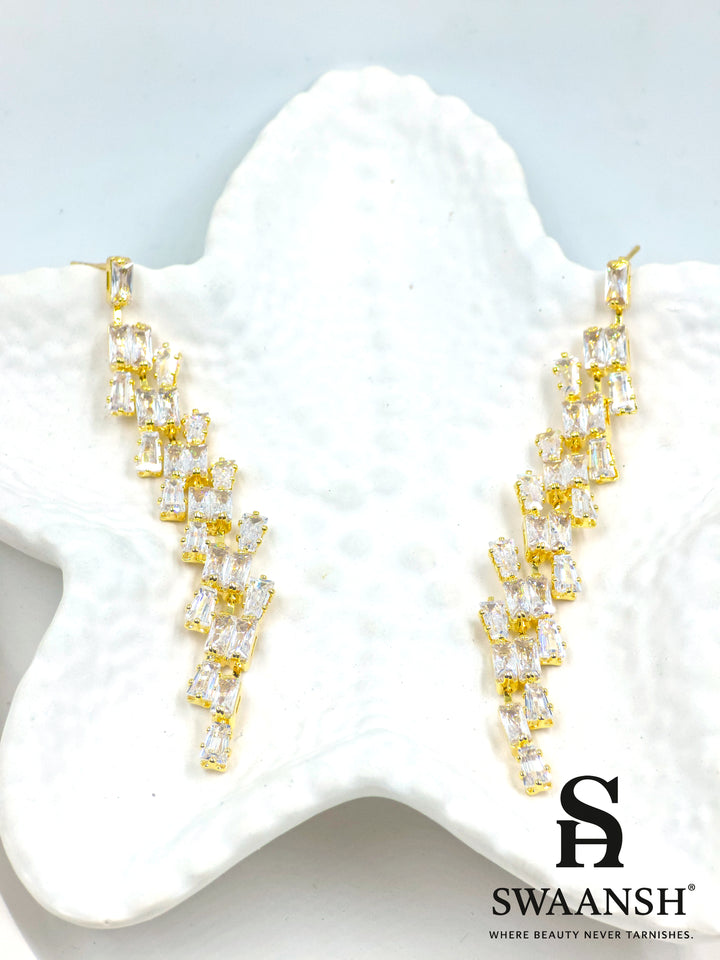 Gold long drop earrings with angular baguette-cut zirconia cascade – Swaansh