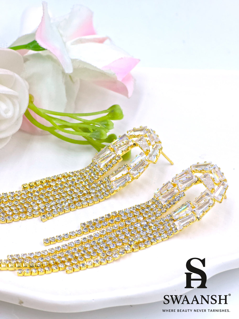 Long gold tassel earrings with baguette-cut crystal tops and fine zirconia strands – Swaansh