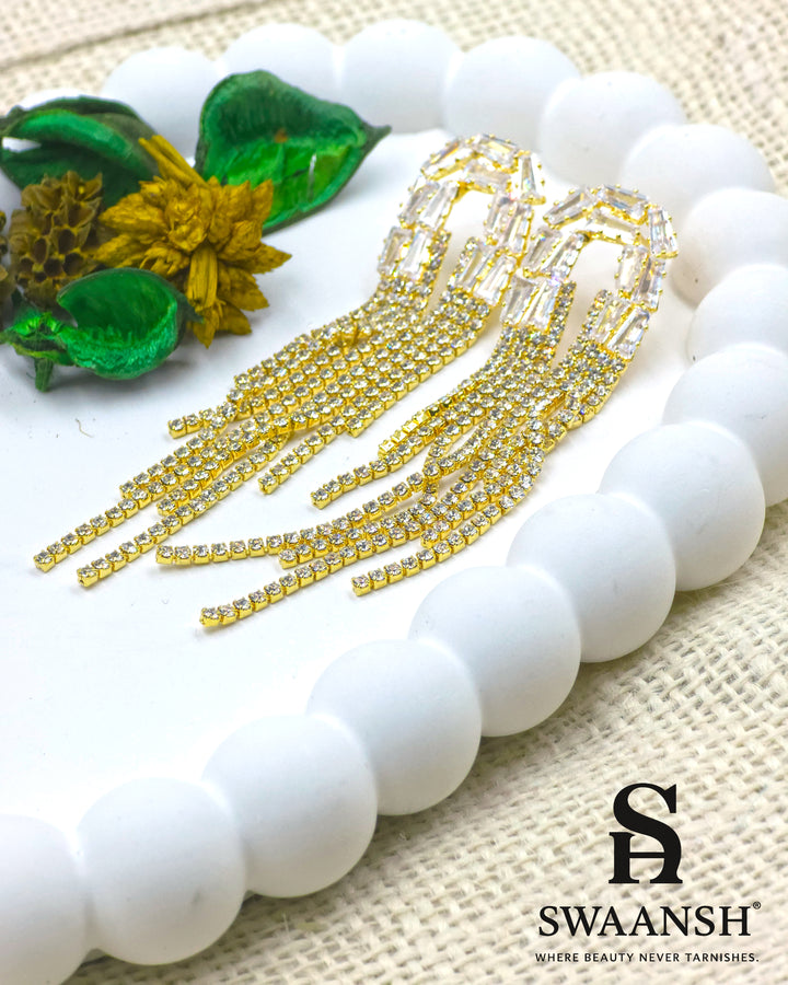 Long gold tassel earrings with baguette-cut crystal tops and fine zirconia strands – Swaansh